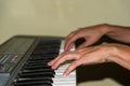 person playing with his hands the keys of a professional piano Royalty Free Stock Photo