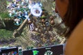 Person playing Starcraft II 2 pc game at gaming convention Royalty Free Stock Photo