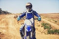 Person, portrait and motorcyclist on dirt bike for extreme sports, outdoor competition or race. Expert or professional Royalty Free Stock Photo