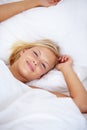 Person, portrait or wake up in home bedroom for relax, sleeping and weekend rest. Smile, awake or happy woman lying or