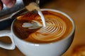 Person Pouring Milk Into Coffee Cup