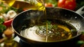 A person pouring olive oil into a pan Royalty Free Stock Photo