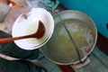 Person pouring russian fish soup Royalty Free Stock Photo