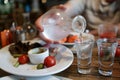 Person pouring vodka from the decanter Royalty Free Stock Photo