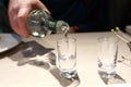 Person pouring vodka Royalty Free Stock Photo