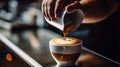 Person Pours Coffee Into a Cup