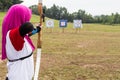 Person practicing at outdoor archery target range Royalty Free Stock Photo