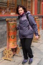 Person in Prayer Spin the prayer wheel at the Lama Temple