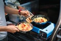 Person preparing food on camping stove Royalty Free Stock Photo