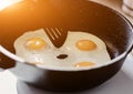 Person preparing fried eggs Royalty Free Stock Photo