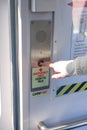 person presses the button to call and talk with the support service of the train or subway. In the event of an emergency situation