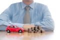 Person Protecting Increasing Coins And Car