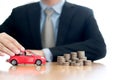 Person Protecting Increasing Coins And Car