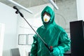 Man using portable tank for disinfection in the room stock photo