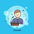 Person in purple shirt standing at lectern with microphone and speaking. Concept of speaker, chairman or lecturer giving Royalty Free Stock Photo