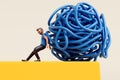A person pushing a tangled ball of string off of a cliff edge. Getting rid of stress and problems. 3D Rendering Royalty Free Stock Photo