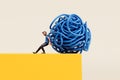A person pushing a tangled ball of string off of a cliff edge. Getting rid of stress and problems. 3D Rendering Royalty Free Stock Photo
