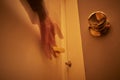 Person reaching out for doorknobs and handles