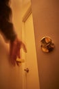 Person reaching out for doorknobs and handles