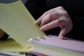 A person reading books near the window. Hands turns over book page Royalty Free Stock Photo