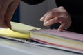 A person reading books near the window. Hands turns over book page Royalty Free Stock Photo