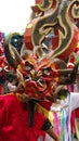 Person in a red devil mask