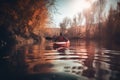 a person in a red kayak paddling down a river