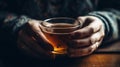 A person holding a cup of tea taking a moment to savor the taste and enjoy the present moment created with Generative AI