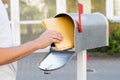 Person Removing Letters From Mailbox Royalty Free Stock Photo