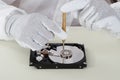 Person Repairing Harddisk Using Screwdriver Royalty Free Stock Photo