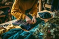 A person repairing or upcycling old clothing items