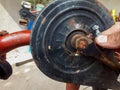 person restoring an old bicycle, photo taken close up