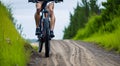 person riding a bicycle in the forest through rural and forest roads Royalty Free Stock Photo