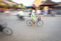 Person riding blue bike in Hoi An, Vietnam, Asia. Royalty Free Stock Photo