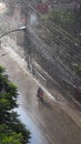 A person riding scooty in the rain in Nepal