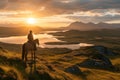 Person riding a horse in beautiful Irish landscape on dramatic sunset. Man admiring scenic view while on horseback riding tour in