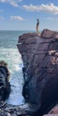 Person on the rocks above Thunder Hole in Acadia National Park Royalty Free Stock Photo