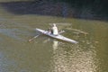 A person rowing boat on Arno River, Florence, Italy