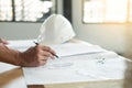 Person`s engineer Hand Drawing Plan On Blue Print with architect