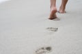 A person`s footprint while walking along the white beach Royalty Free Stock Photo