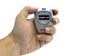 Person's hand holding a stopwatch for running time displaying Hurry up text on a white background Royalty Free Stock Photo