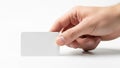 A person s hand holds a blank white business card against a white background Royalty Free Stock Photo