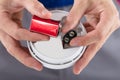 Person`s Hand Inserting Battery In Smoke Detector Royalty Free Stock Photo