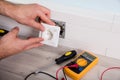 Person`s Hand Installing Socket On Wall Royalty Free Stock Photo