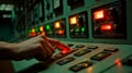A person\'s hand is pressing a button on a control panel Royalty Free Stock Photo