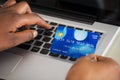 Person's Hand Using Debit Card While Shopping Online Royalty Free Stock Photo