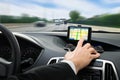 Person's hand using gps navigation system in car Royalty Free Stock Photo