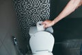 Person`s Hand Using Toilet Paper Royalty Free Stock Photo