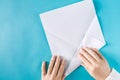 Person`s hands folding a paper airplane Royalty Free Stock Photo