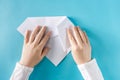 Person`s hands folding a paper airplane Royalty Free Stock Photo